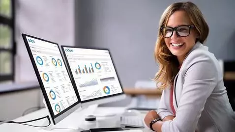 AI Video from prompt: A smiling woman wearing glasses is seated at a d