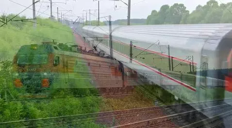 AI Video from prompt: Photograph of a red and gray DB electric train w