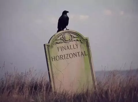 AI Video from prompt: A crow caws and flaps on a tombstone