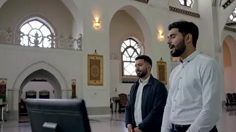 AI Video from prompt: An Islamic man singing a hymn with a Christian m