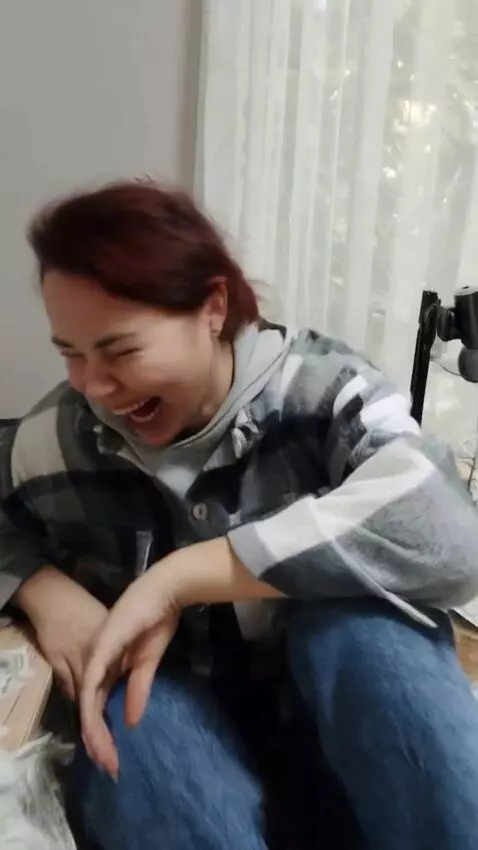 AI Video from prompt: Young woman in casual clothes — jeans and hoodie