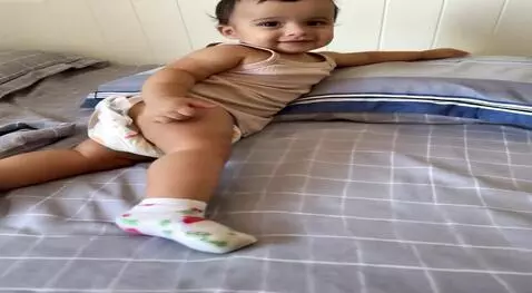 AI Video from prompt: The child is waving his hand