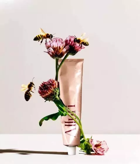 AI Video from prompt: bees are flying around, and some are crawling on