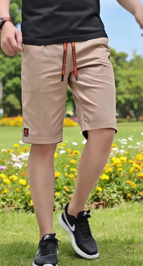 AI Video from prompt: A man showing off his shorts in a cool stylish w