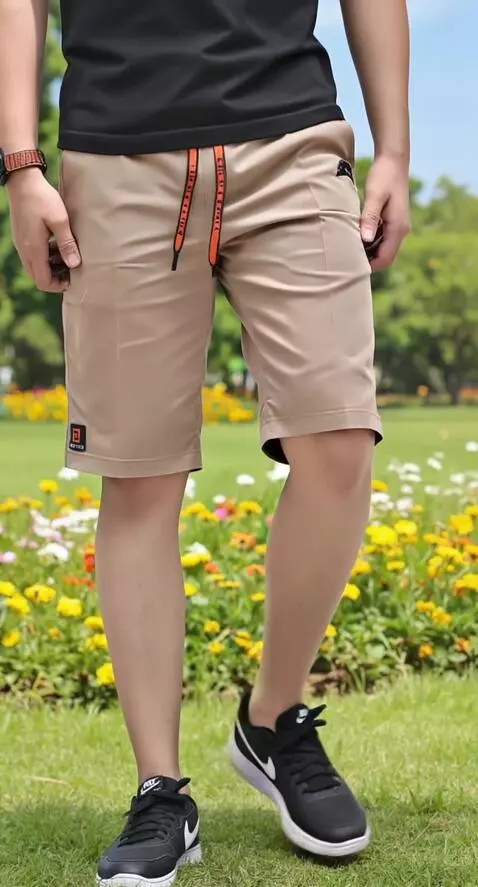 AI Video from prompt: A man showing off his shorts in a cool stylish w