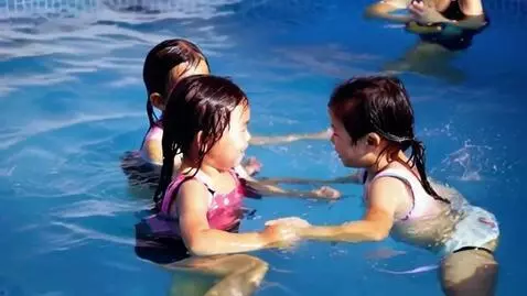 AI Video from prompt: Little girls swimming in loose clothes
