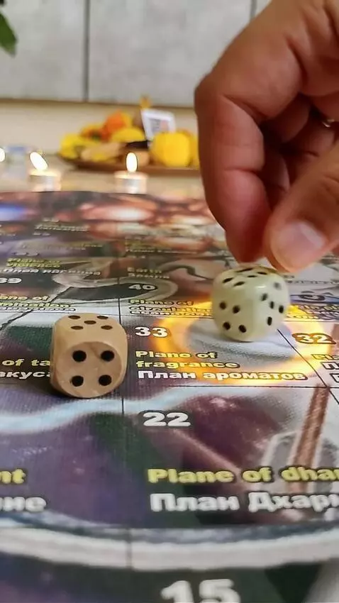 AI Video from prompt: Close up of hand releasing 2 white dice, for boa