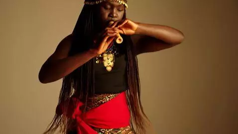 AI Video from prompt: "Carmen — dark-skinned young woman, 20–22 years 