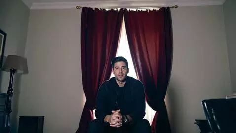 AI Video from prompt: Create a scene where a person is sitting in fron