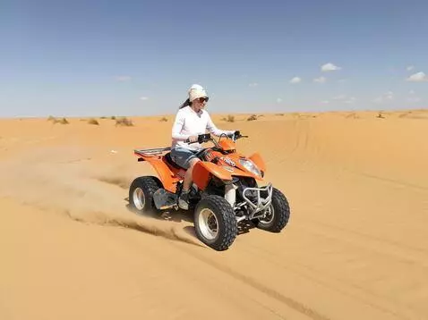 AI Video from prompt: A girl is racing an ATV through the desert