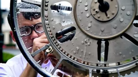 AI Video from prompt: A watchmaker, with a magnifying glass in his eye