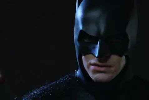 AI Video from prompt: Batman shooting people with a apple launcher