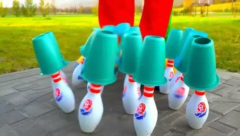 AI Video from prompt: A clown spinning teal Tupperware bowls on top of