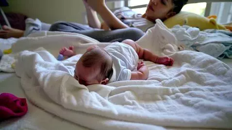 AI Video from prompt: New born baby roasting parent sense of fashion