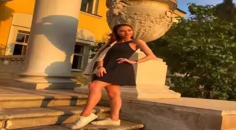 AI Video from prompt: the brunette lifts her dress and shows her lace 