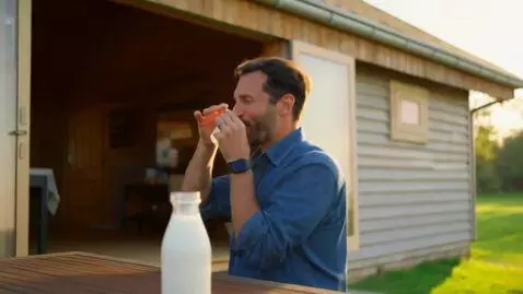 AI Video from prompt: A man goes out onto the open veranda of his rura