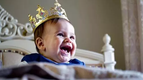 AI Video from prompt: Queen Elizabeth as a laughing baby with a crown