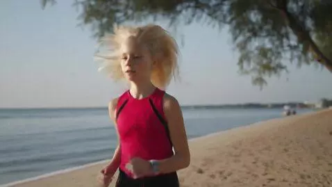 AI Video from prompt: blond girl running on the beach.