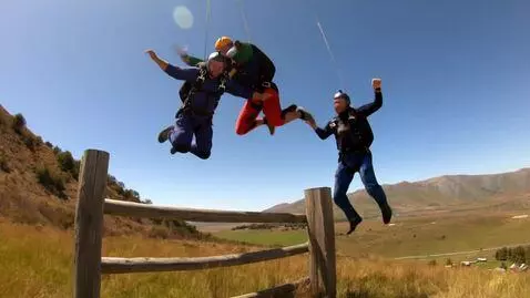 AI Video from prompt: The two guys in the photo are jumping over the f