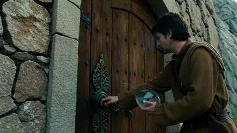 AI Video from prompt: A traveler with a glass compass finds a door car