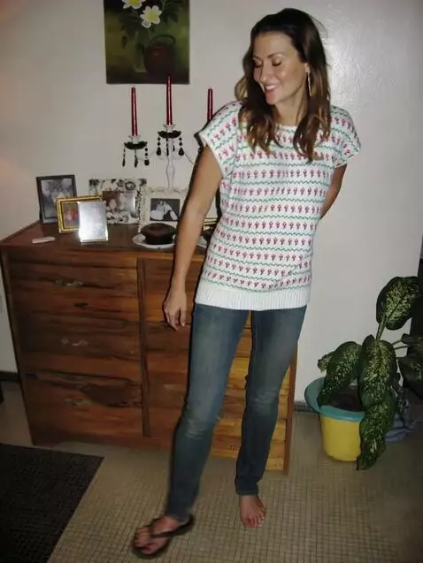 AI Video from prompt: A young woman with dark hair, wearing blue jeans