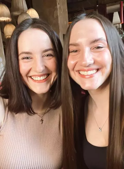 AI Video from prompt: a business lady in black nylon stockings is sitt