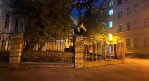 AI Video from prompt: Make the man sitting on the column turn into a g