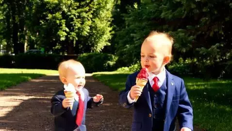 AI Video from prompt: Baby Donald Trump walks in a suit to eat ice cre