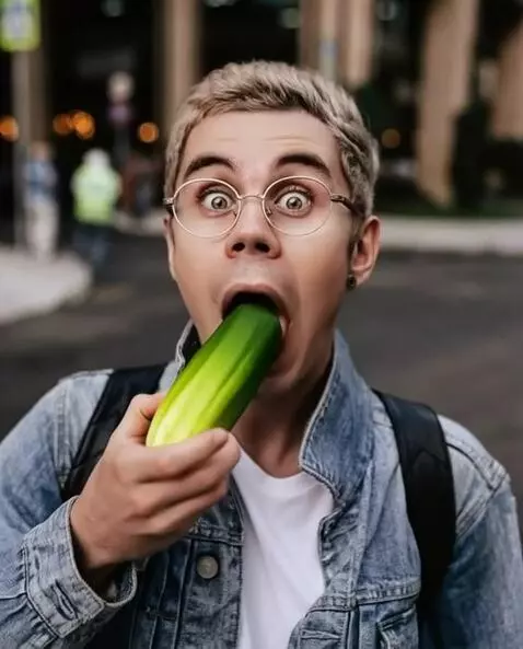 AI Video from prompt: He finishes the wild cucumber and takes a bite, 