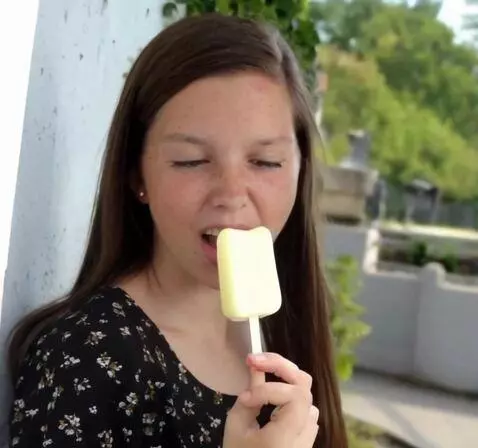 AI Video from prompt: she sucks on a popsicle over and over