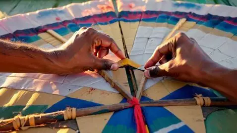 AI Video from prompt: Open on a close-up of weathered hands meticulous