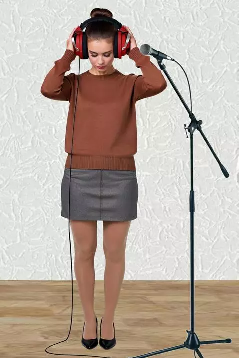 AI Video from prompt: A woman wearing headphones. She lets her hair do