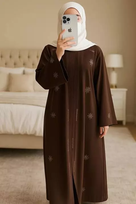 AI Video from prompt: A modest woman wearing a white hijab and a dark 