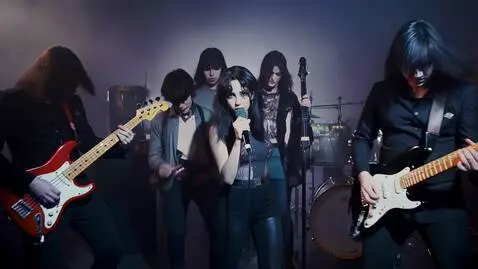 AI Video from prompt: A gothic indie rock band with a cute pretty girl