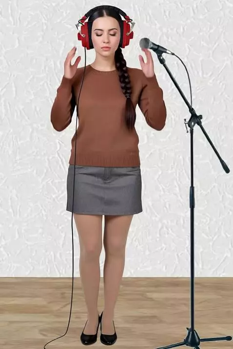 AI Video from prompt: A young woman in a recording studio.  He listens