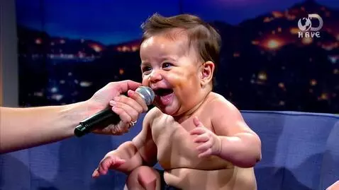 AI Video from prompt: A humorous, empowering scene: a baby is being ‘i