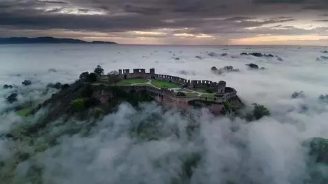 AI Video from prompt: cinematic drone shot, a haunting aerial view of 