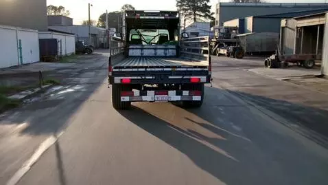 AI Video from prompt: A Kamaz truck drives through an industrial zone 
