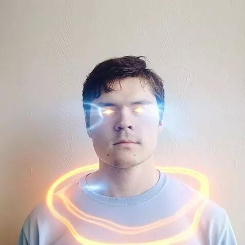 AI Video from prompt: The young man stands against a plain wall, his b