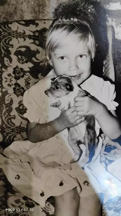 AI Video from prompt: playing with a dog that is in his arms