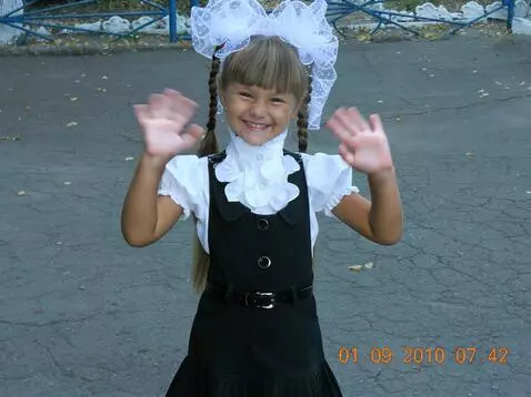 AI Video from prompt: He smiles and waves with both hands.