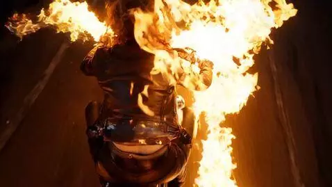 AI Video from prompt: A woman in a burnt leather biker jacket rides he