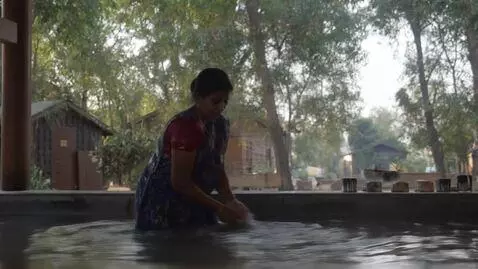 AI Video from prompt: india village woman, washing herself in bath