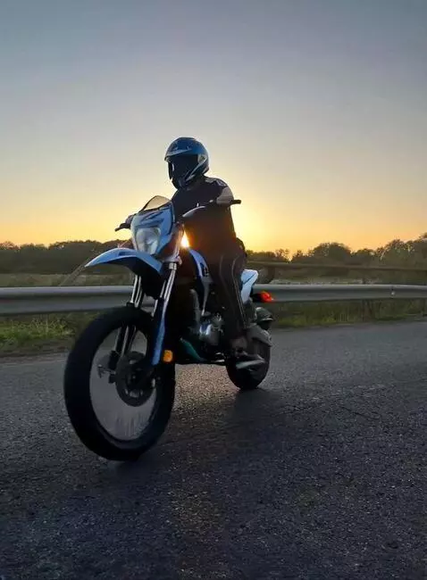 AI Video from prompt: Make a video of me riding a motorcycle and getti