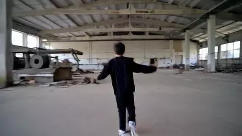 AI Video from prompt: A boy in black and a mask walks around an abando