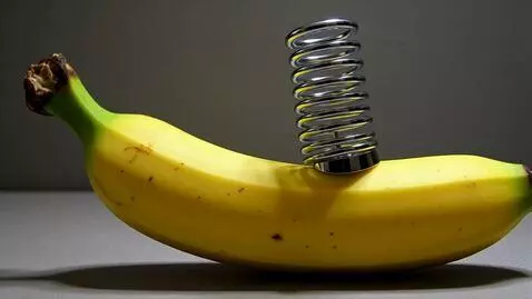 AI Video from prompt: A banana bright shiny yellow has a chrome metal 