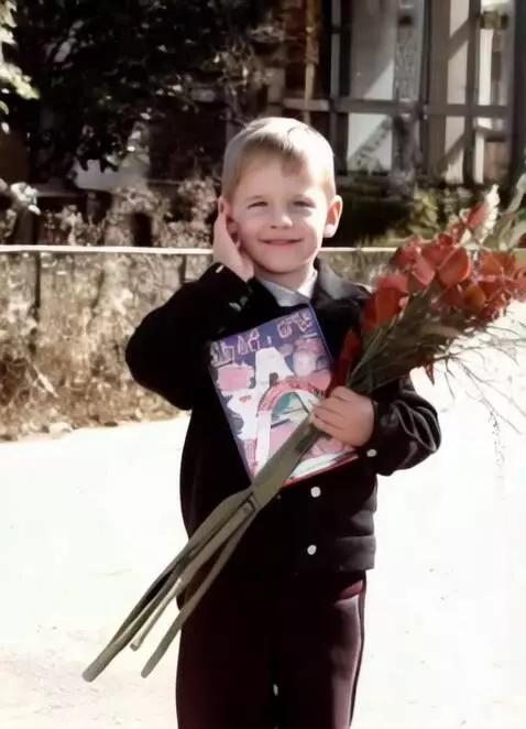 AI Video from prompt: The boy is standing and looking at the camera. H