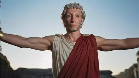 AI Video from prompt: The man raises arms, stretches hands higher ahea