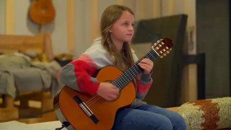 AI Video from prompt: A girl plays a medieval guitar