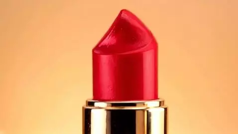 AI Video from prompt: The JEANMISHELL lipstick tube rotates slowly to 